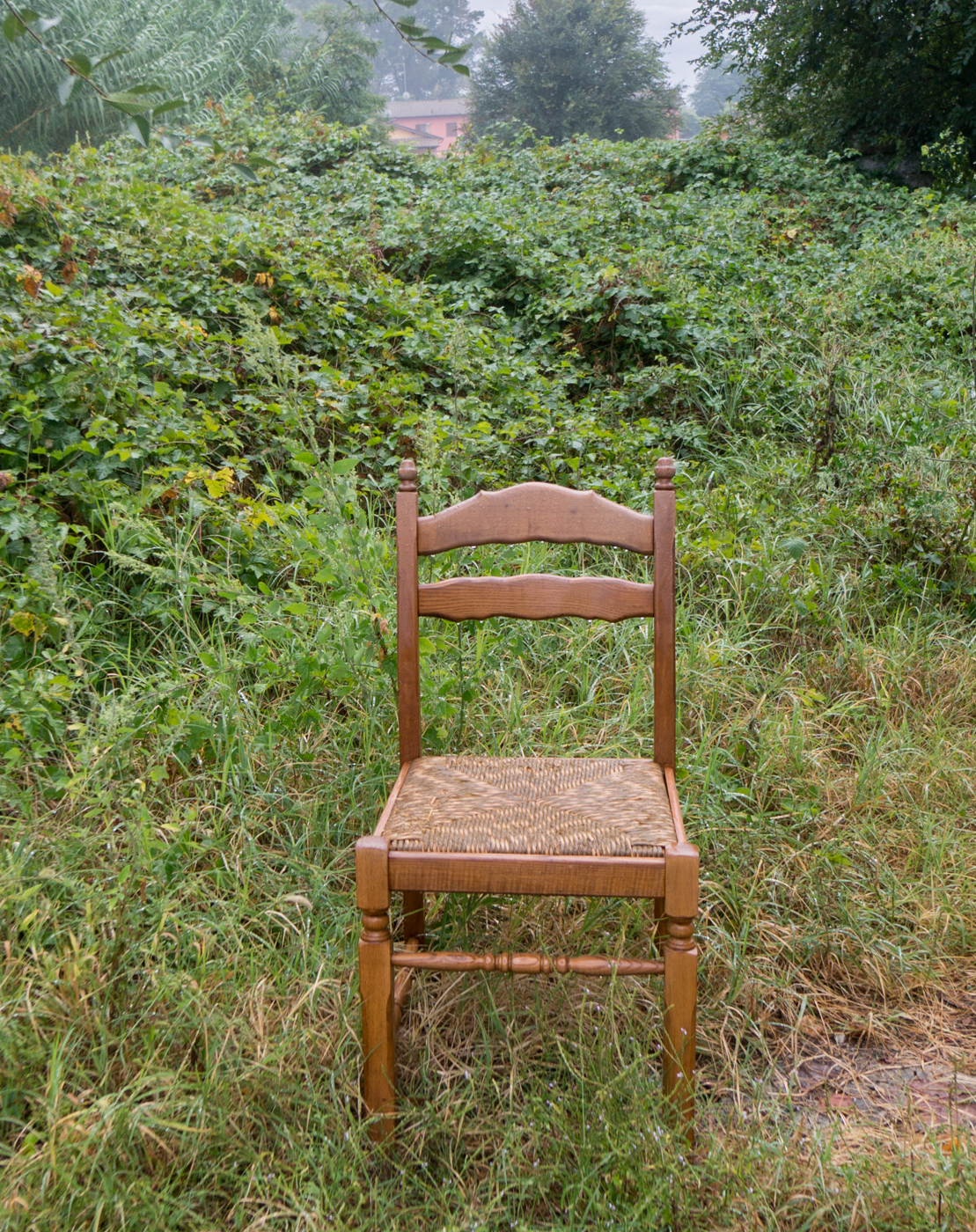 A chair for weary pilgrims placed along the Via Francigena southeast of Mortara, Italy | Photo by Mike Hudak