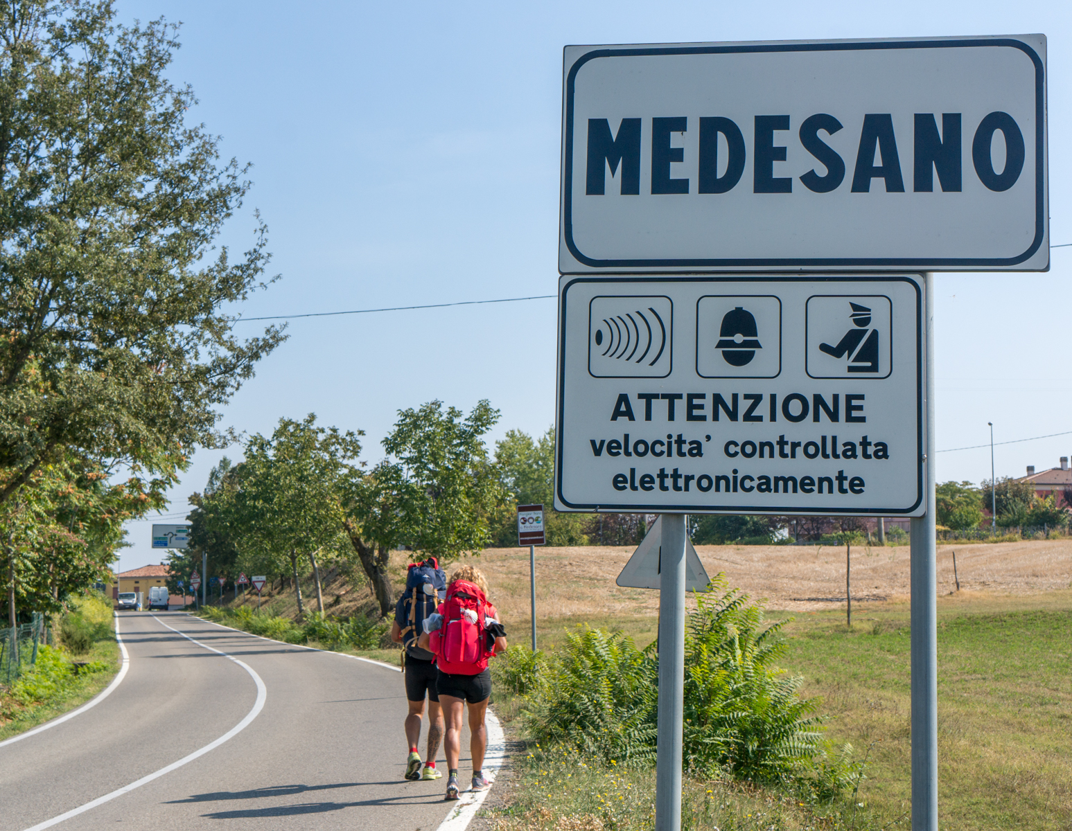 Pilgrims enter Medesano (Italy) on Via Giuseppe Verdi (as the Via Francigena) | Photo by Mike Hudak