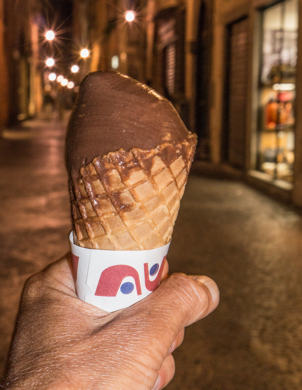 The photographer enjoys a vegan chocolate gelato in Lucca, Italy | Photo by Mike Hudak
