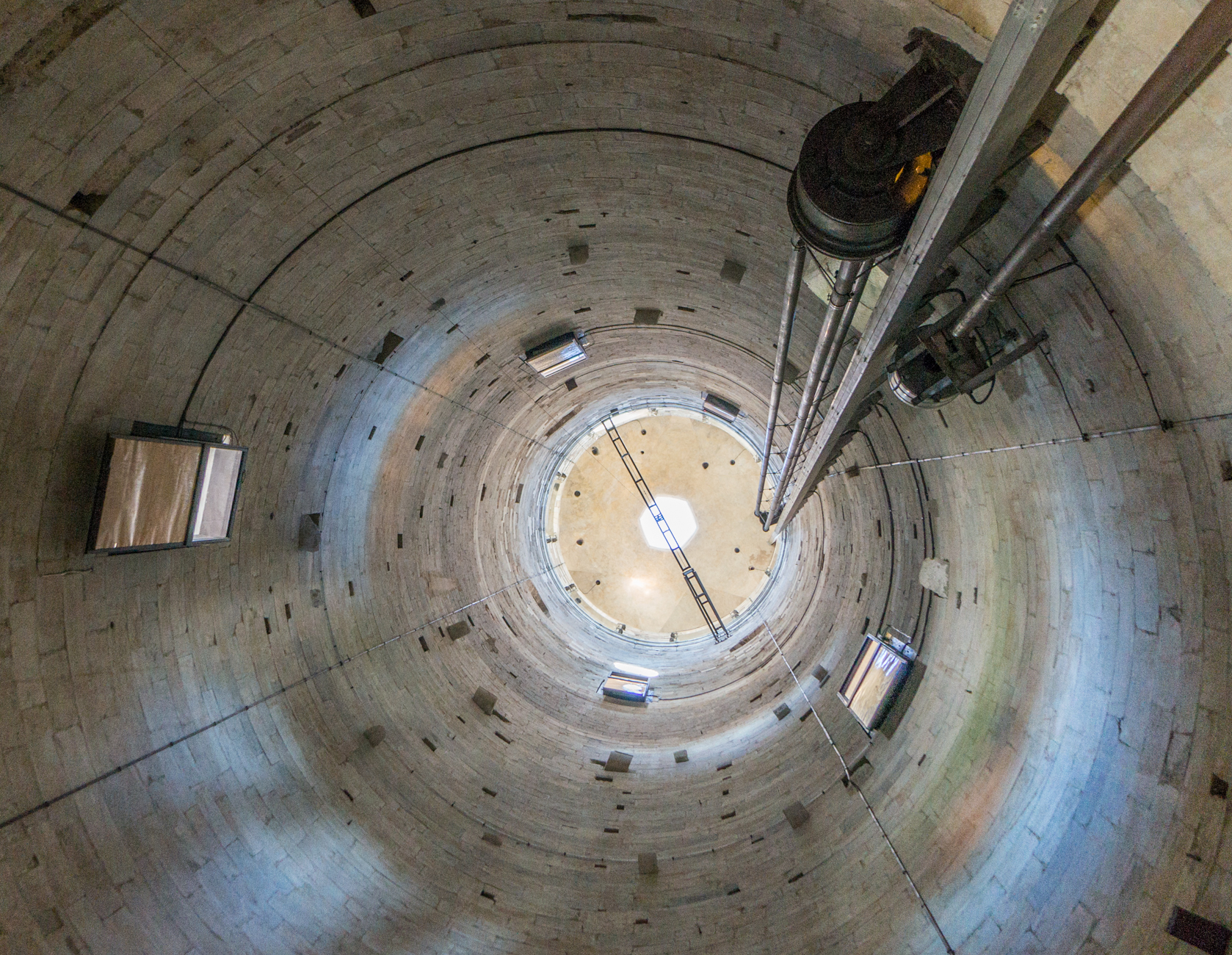 Upward view within the 12th–14th-century Torre Pendente di Pisa (Leaning Tower of Pisa) | Photo by Mike Hudak