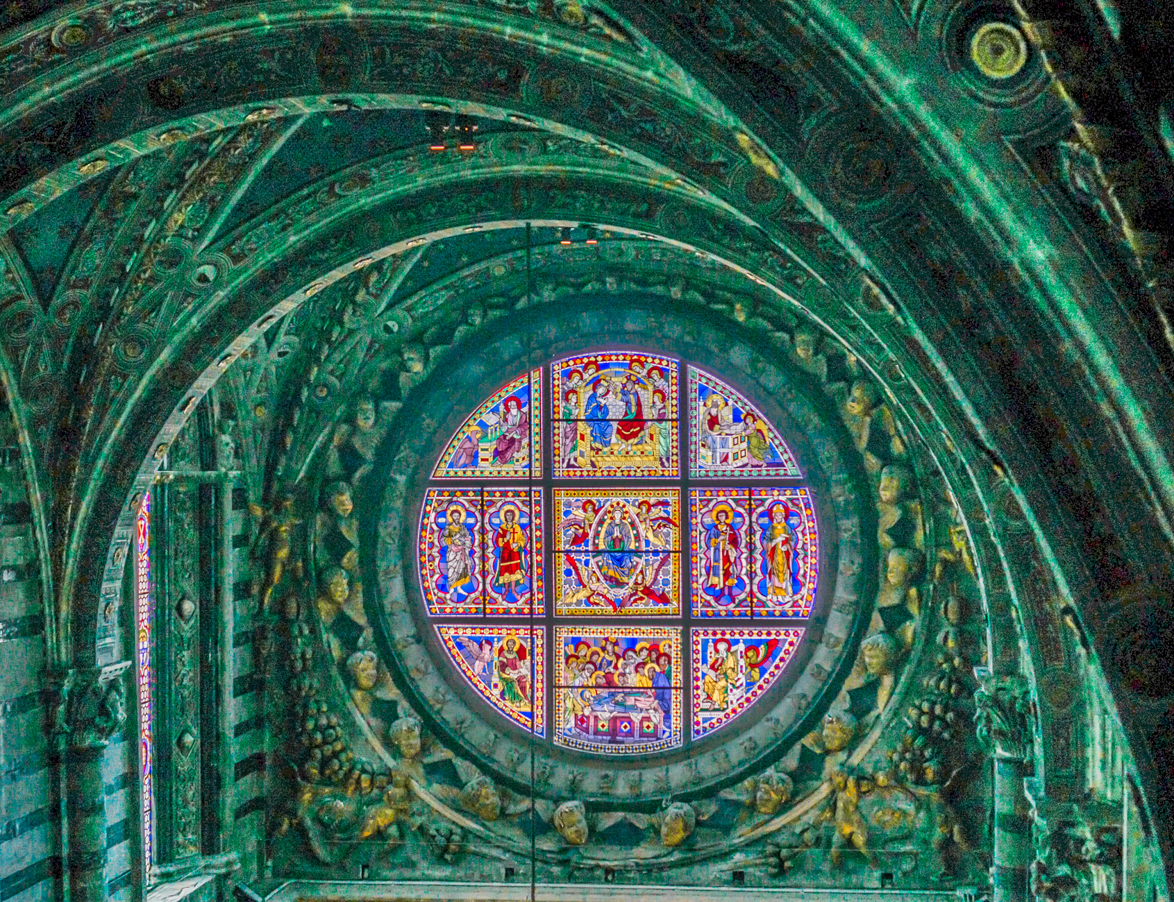 Interior view of the large oculus on the apse wall of of the 13th-century Duomo di Siena (Italy) | Photo by Mike Hudak