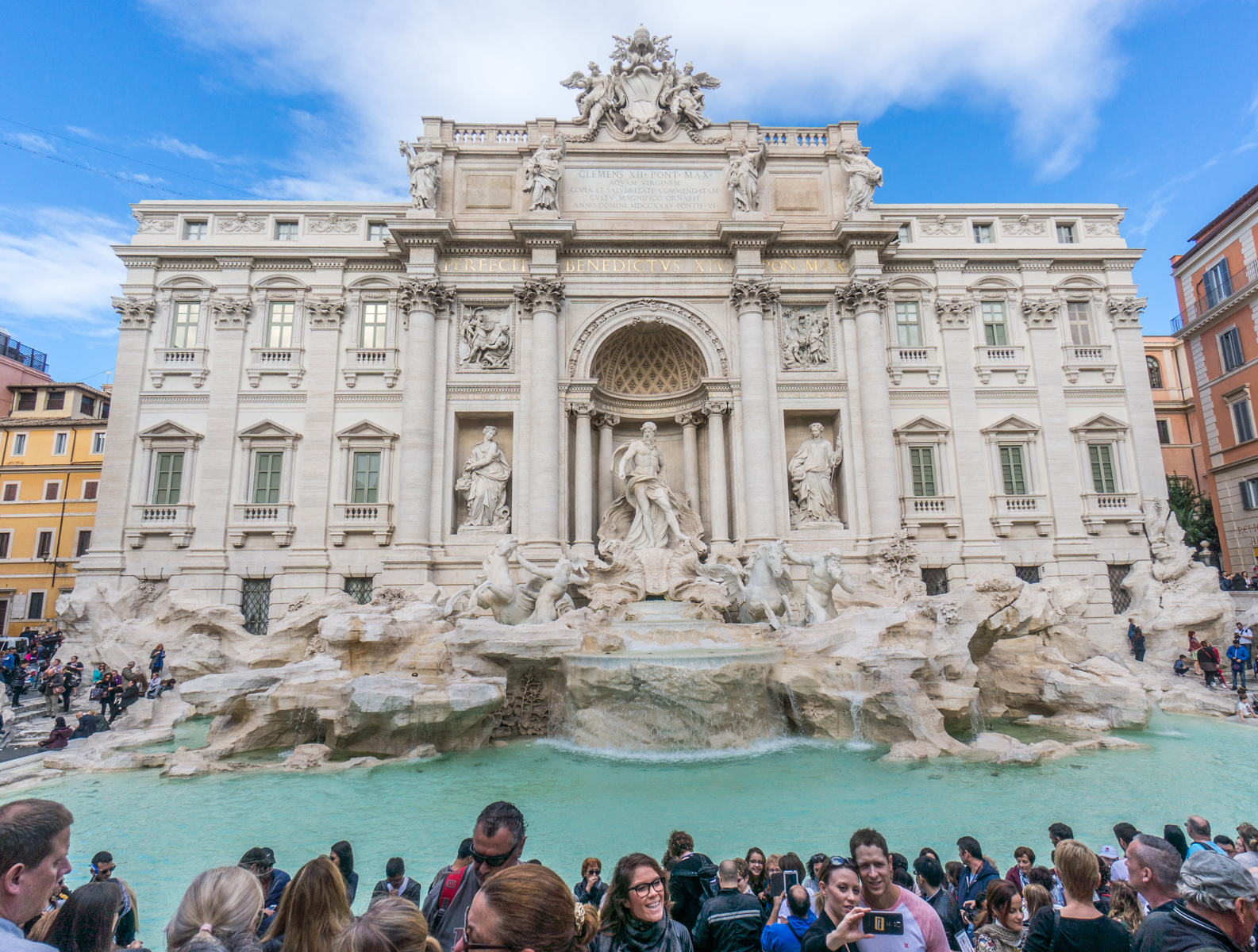 Tourists pose for selfies in front of Rome's Trevi Fountain | Photo by Mike Hudak