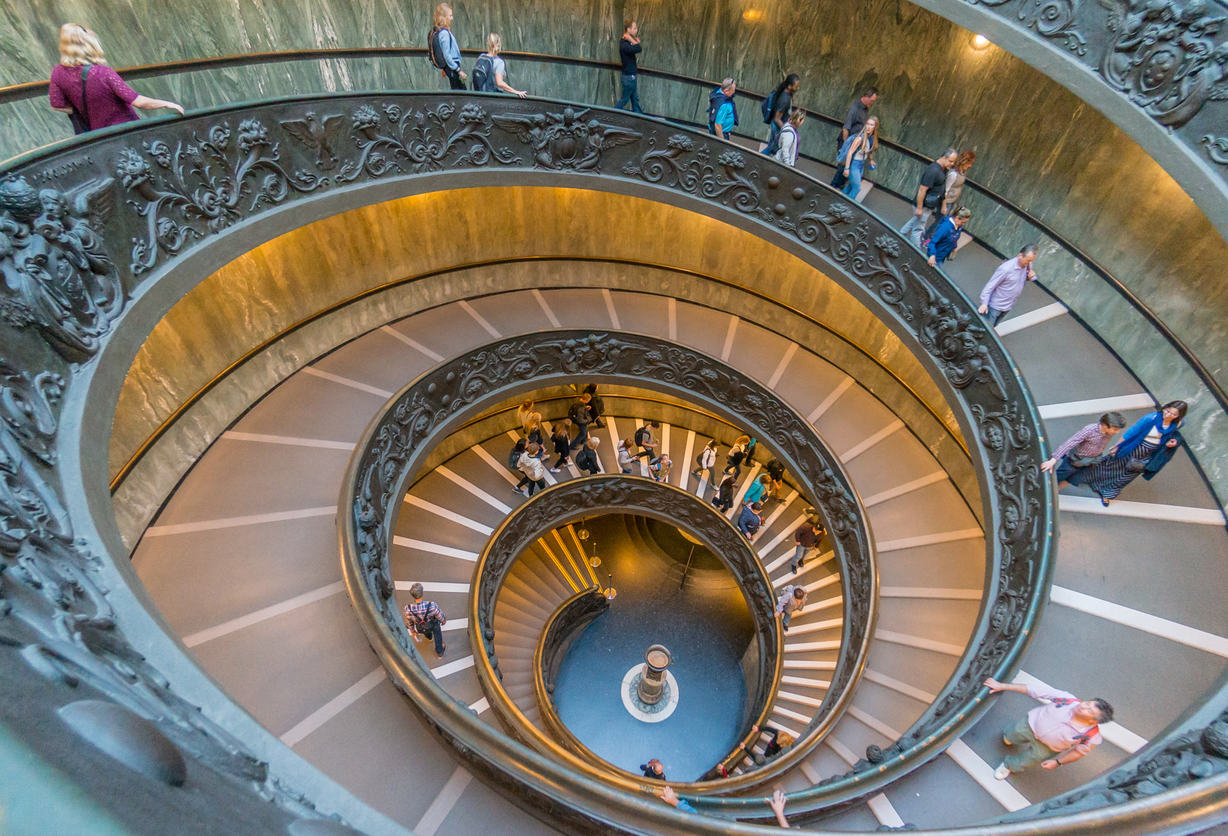 Visitors exit the Musei Vaticani (Vatican Museums) on the Bramante Staircase | Photo by Mike Hudak